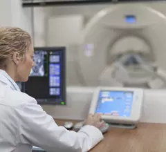 a doctor at a medical device control panel