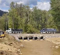 The temporary rock bridge is now allowing access to the Baxter North Cove IV bag plant in North Carolina, which has enabled cleanup crews to begin work on the flooded plant that supplies 60% of U.S. IV bags.