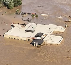Helicopters rescue staff and patients from the roof of Ballad Health's Unicoi County Hospital in Erwin, Tennessee after a flash flood overtook the hospital with raging waters 5-8 feet high.Virginia State Police photo
