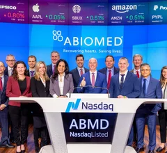 Michael Minogue (center) and other Abiomed representatives. Image courtesy of Minogue's campaign.