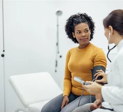 female patient speaking with a doctor