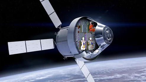 Artists rendering of the Artemis I mission Orion space capsule with a cut away showing the two radiation detecting human phantoms. NASA/Lockheed Martin/DLR image