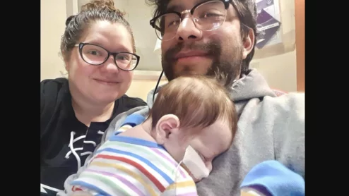 A baby in New York underwent open heart surgery as it was being delivered in what is believed to be the first operation of its kind. 