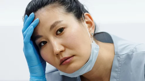 tired doctor headache