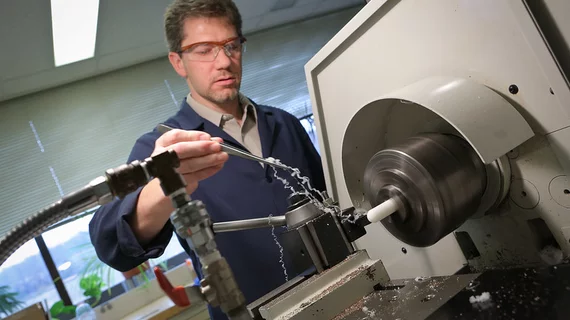 Machinist Patrick Leibich of Penn State College of Medicine’s division of Applied Biomedical Engineering works to create artificial heart parts. Image courtesy of Penn State.