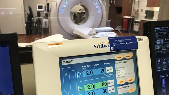 CT contrast injector data screen in a control room with the CT scanner in the background, at Northwestern Medicine Central DuPage Hospital.