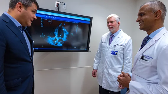 Andrei Churyla, MD, Douglas Johnston, MD, and R. Kannan Mutharasan, MD, tour a clinic room designed for future AI technology pilots at Palos Hospital.