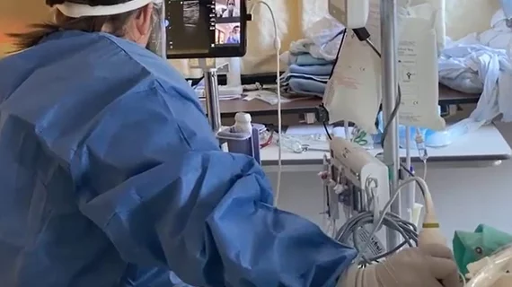 Video of American Society of Echocardiography (ASE) leadership explaining how the society recognized early the need for standardization and training for on and stepped forward to offer training for various point of care ultrasound (POCUS) users and to bring them into its membership. Image shows a critical care COVID patient being scanned with a Philips Lumify point-of-care ultrasound system with doctors on screen helping guide the user. #POCUS #ASE #ASE2023