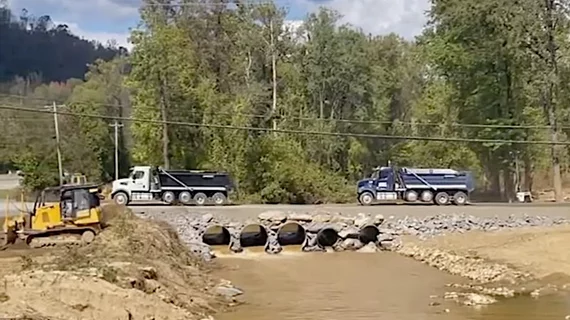 A temporary rock bridge provides access to the Baxter North Cove IV bag plant in North Carolina, which has enabled cleanup crews to begin work on the flooded plant that supplies 60% of U.S. IV bags. Photo from Baxter.
