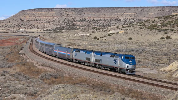 Amtrak eastbound Southwest Chief about to pass under Route 66