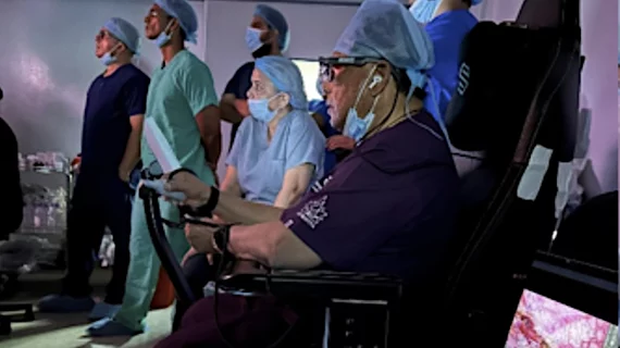 Sudhir Srivastava performing a left internal mammary artery (LIMA) takedown robot-assisted heart procedure on a patient in India, with the surgeon located at Georgetown Public Hospital Corp. (GPHC) in Guyana, 12,500 miles away.