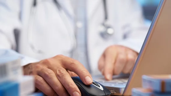physician using EHR system